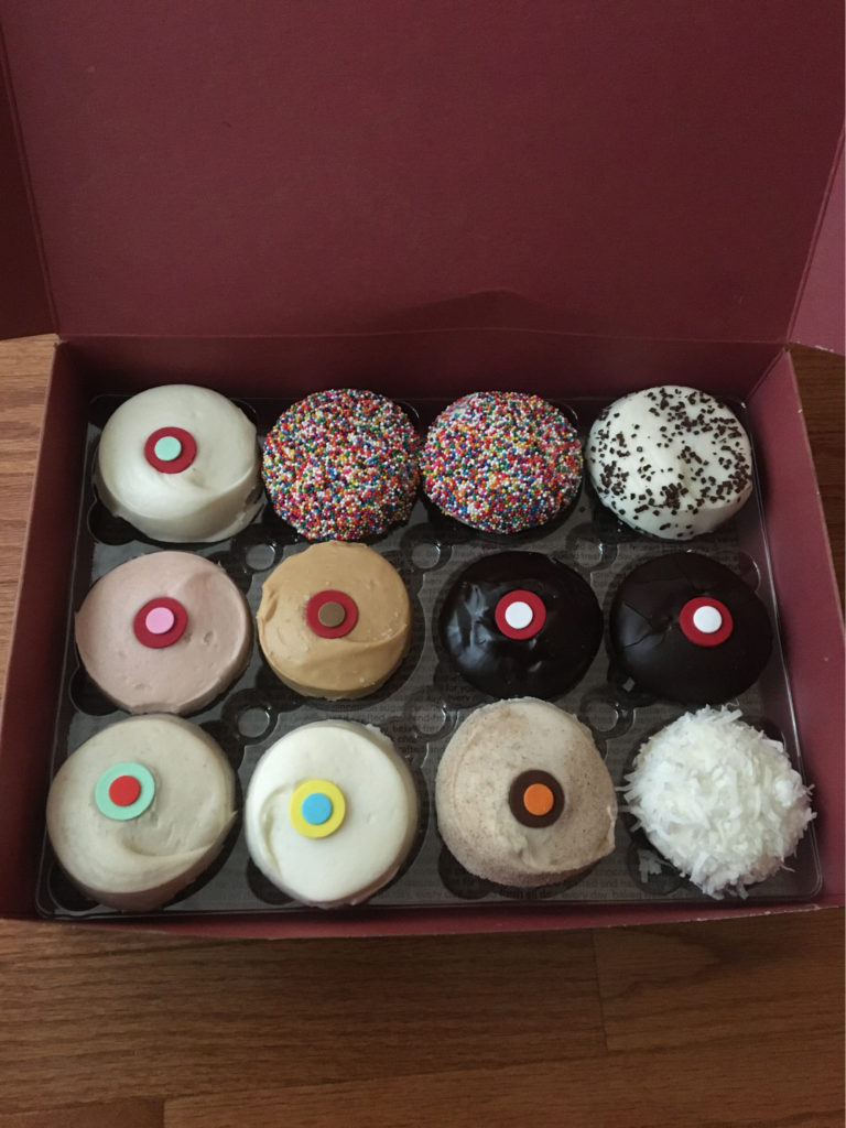 a dozen sprinkles cupcakes